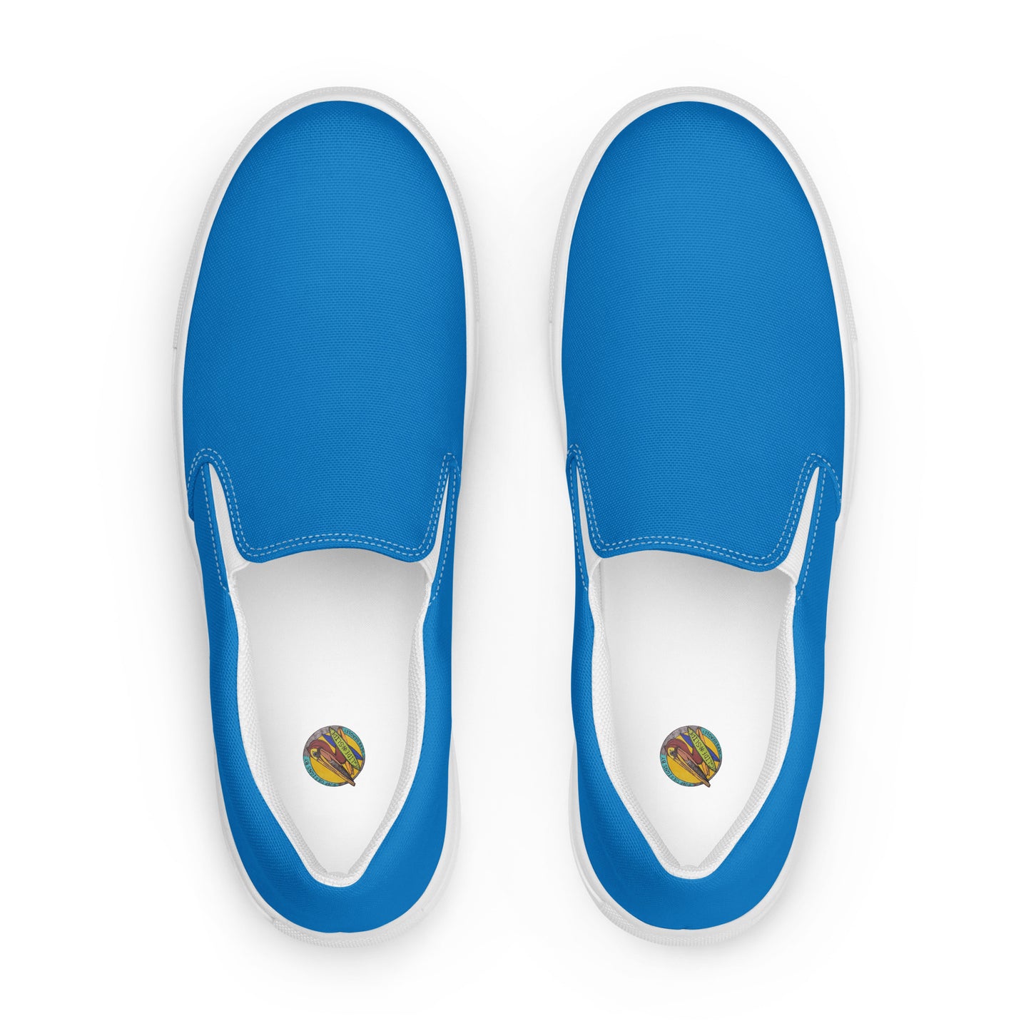 Blue slip-on shoes with white soles on a white background