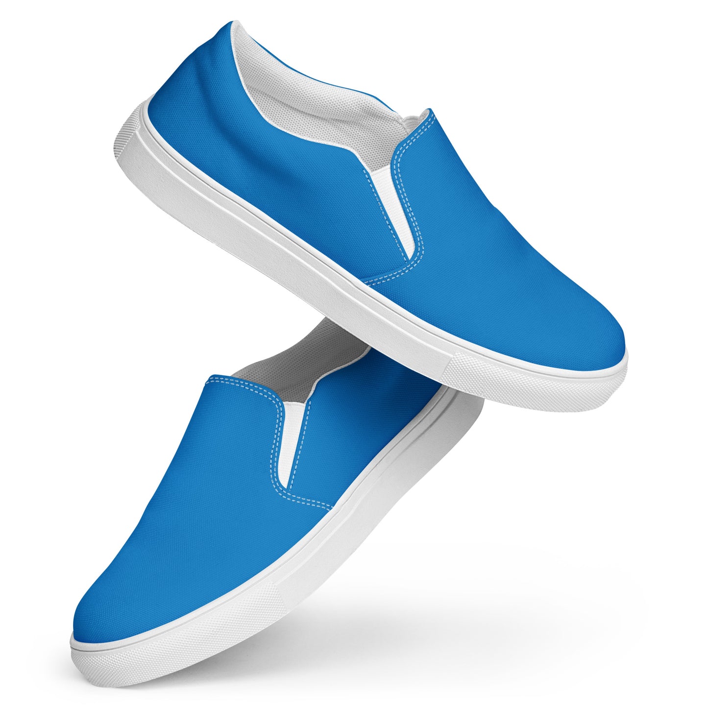 Blue slip-on sneakers with white soles on a white background