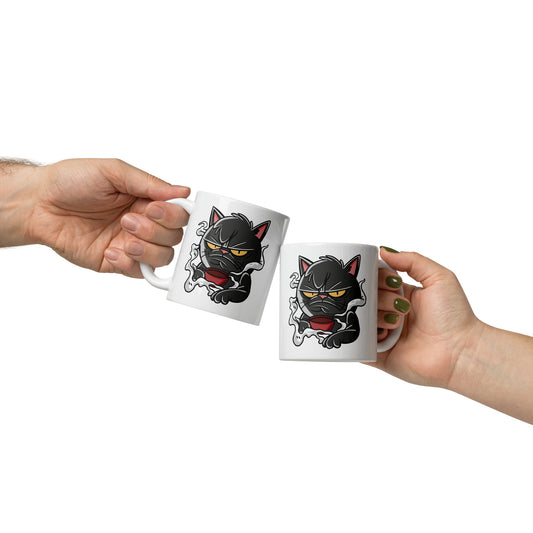 Two white mugs with black cat designs held by two hands against a white background