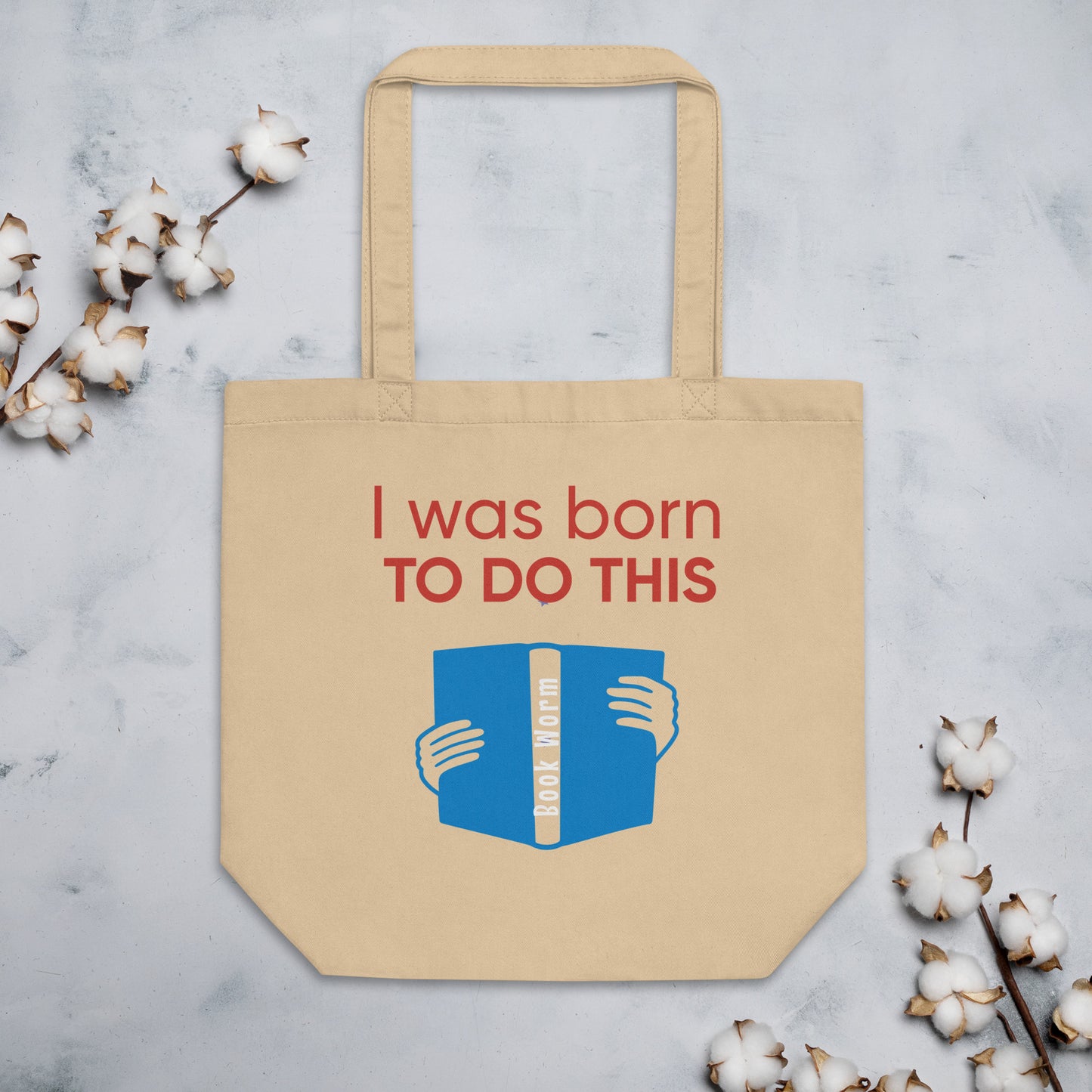 Beige Eco friendly Tote bag that says, I was born to do this with a book on it
