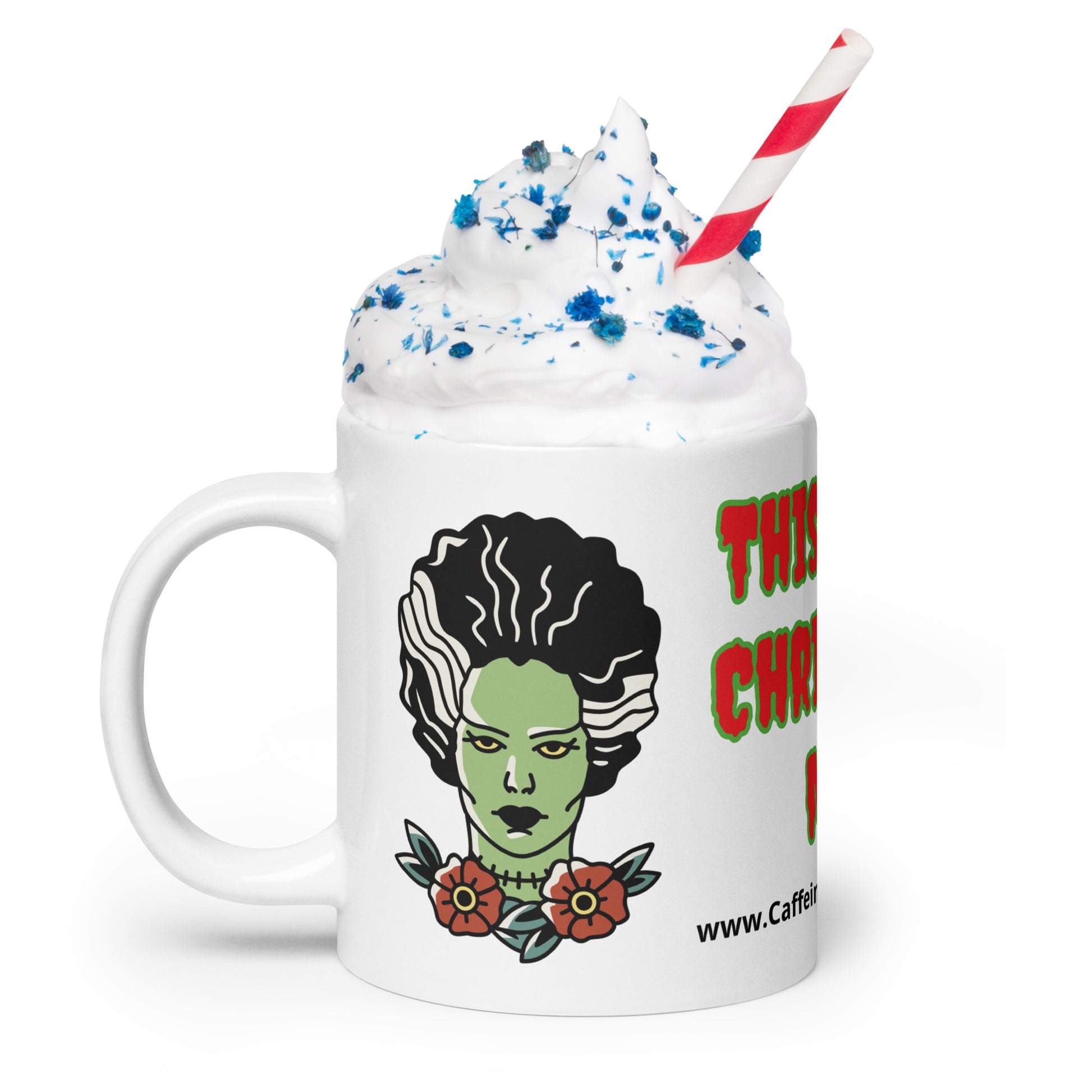 Frankenstein's bride right side view with handle showing and whipped cream in a cu with blue sprinkles and a straw in the cup