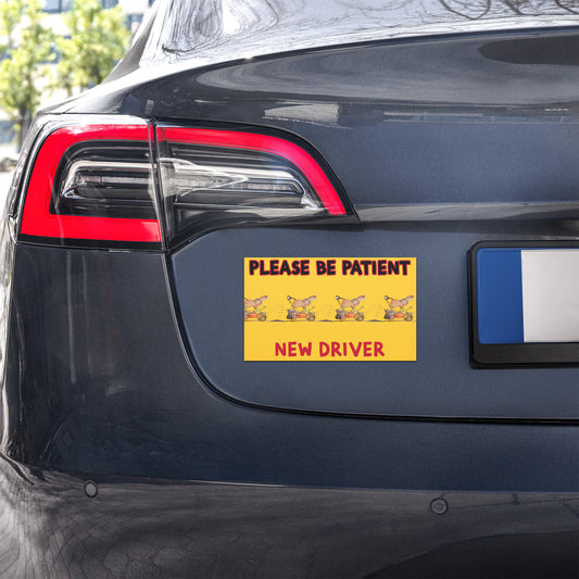 Car with a 'Please be patient, new driver' sign on the back
