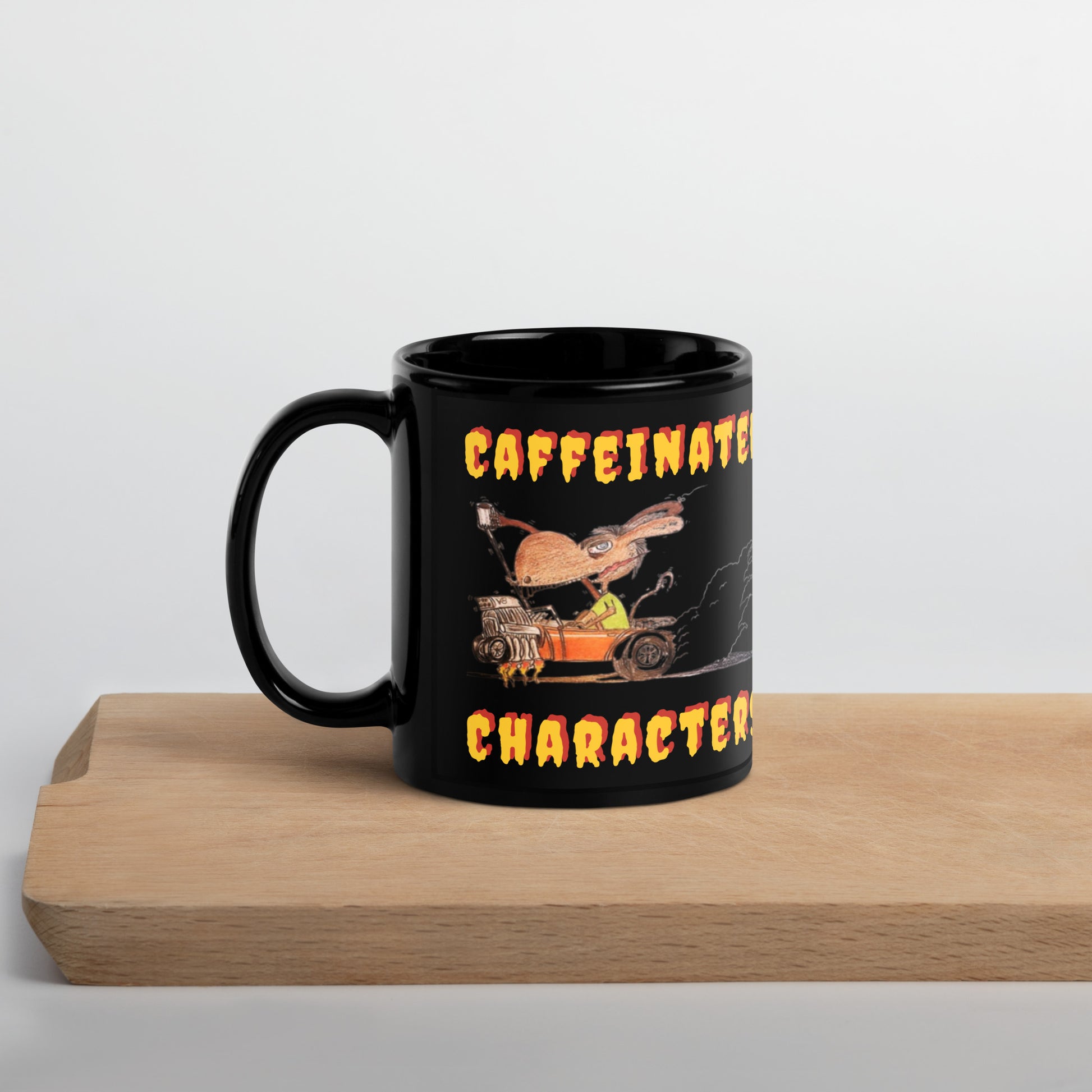 Caffeinated_Characters-Yellow_and_Orange-black-glossy-mug-11-oz-handle-on-left-sitting_on_a_wood_shelf