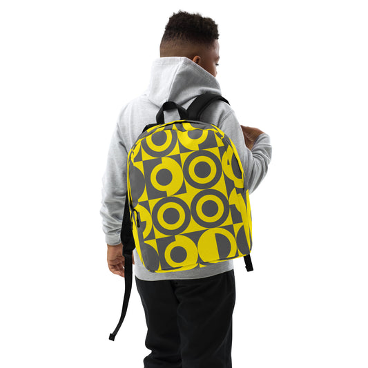 Yellow and Grey Geometric Pattern Backpack, back view on the shoulder of a young boy