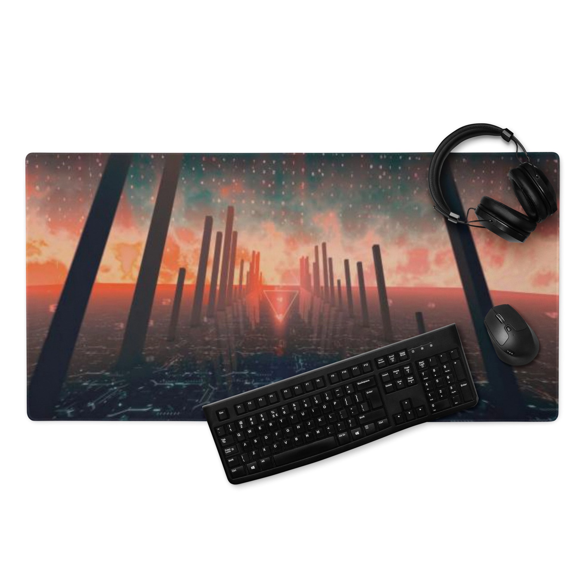 Desk setup with a large mouse pad featuring a futuristic landscape, keyboard, mouse, and headphones.