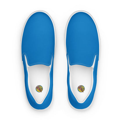 Blue slip-on shoes with white soles on a white background