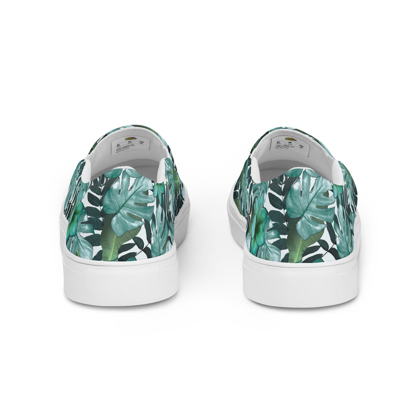 multicolor green tropical print canvas slip on shoes back view showing the size label inside the shoe under the tongue
