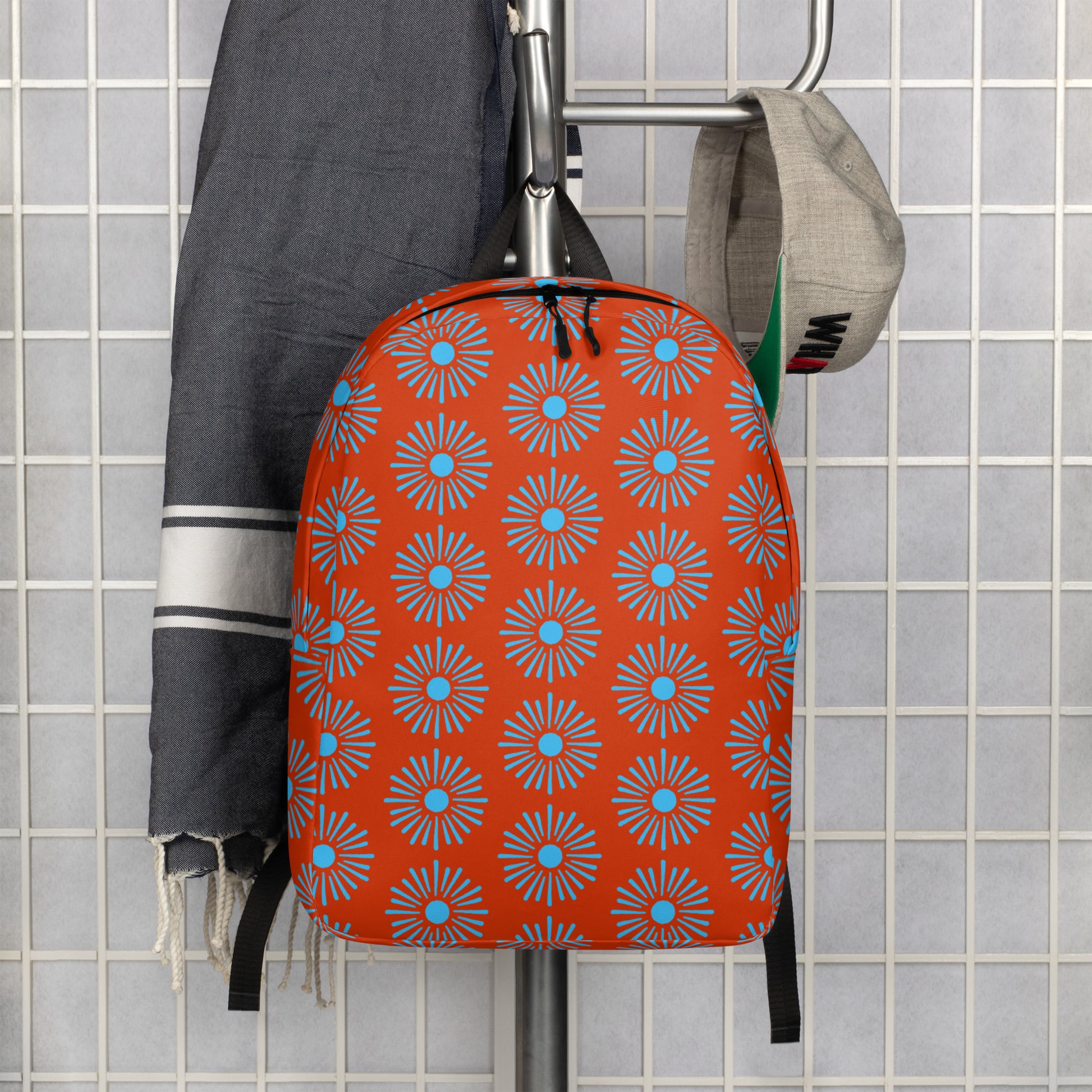 All over Floral Print Minimalist backpack front view hanging on a coat rack