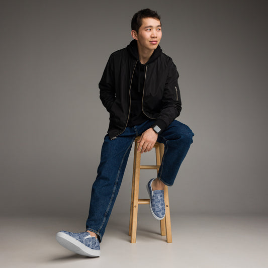 mens-slip-on-canvas-shoes with aloha print, man sitting on stool