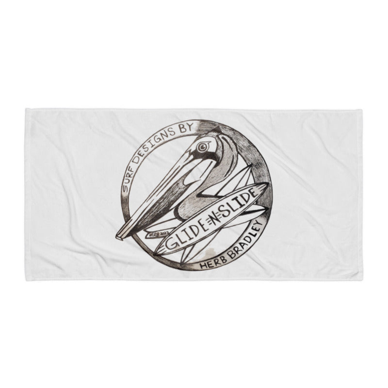 Grey Glide -N- Slide Giant Beach Towel with grey and black logo laying flat on the ground