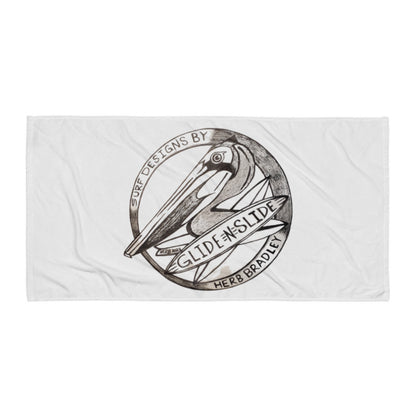 Grey Glide -N- Slide Giant Beach Towel with grey and black logo laying flat on the ground