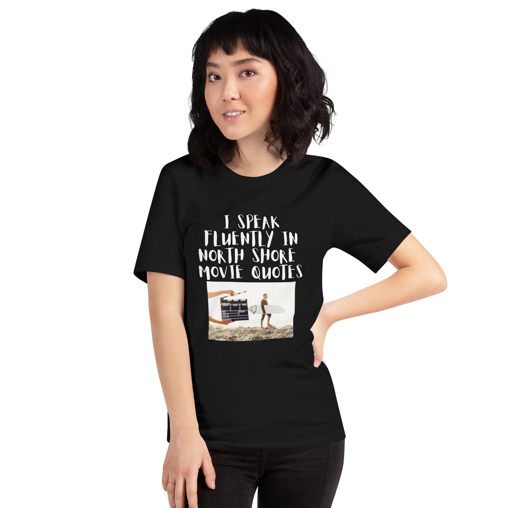 I speak in North Shore Movie Quotes in  large text, Picture of a Movie Scene Marker with Surfer holding a surfboard on the beach short sleeve t-shirt  in black
