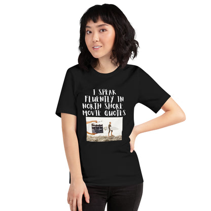 I speak in North Shore Movie Quotes in  large text, Picture of a Movie Scene Marker with Surfer holding a surfboard on the beach short sleeve t-shirt  in black