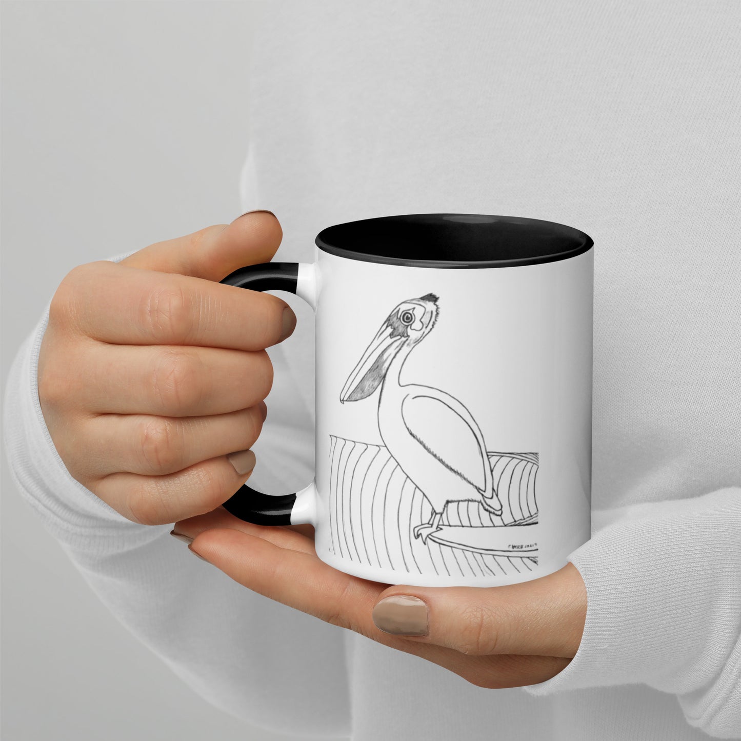 11oz Pelican Hanging Ten White mug with black color inside and on handle