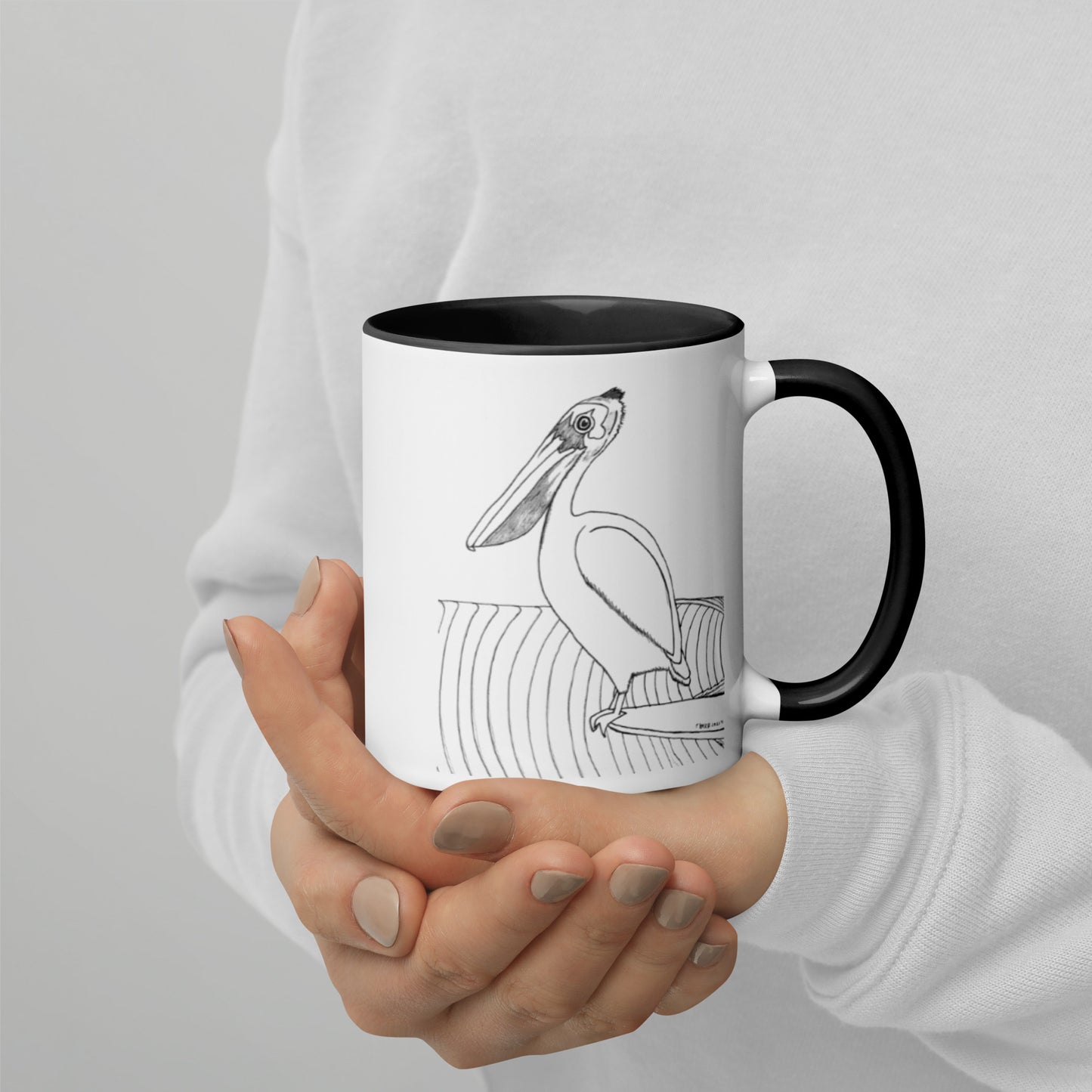 11oz Pelican Hanging Ten White mug with black color inside and on handle