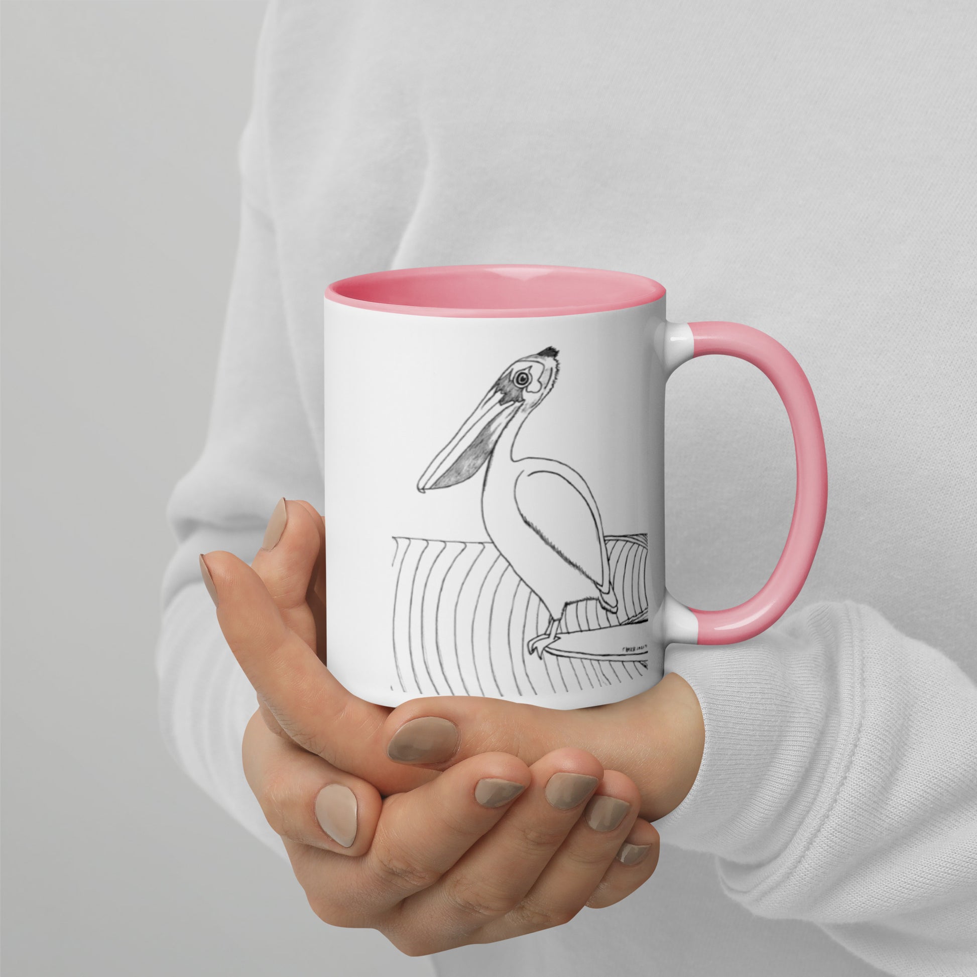 11oz Pelican Hanging Ten White mug with pink color inside and on handle